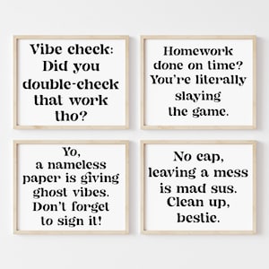 May include: Four framed prints with motivational quotes in black text on a white background. The quotes are: "Vibe check: Did you double-check that work tho?", "Yo, a nameless paper is giving ghost vibes. Don't forget to sign it!", "Homework done on time? You're literally slaying the game.", and "No cap, leaving a mess is mad sus. Clean up, bestie."