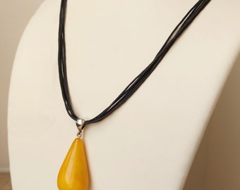 Black Necklace with Egg Yolk Amber Pendant