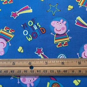 It&#39;s Peppa Pig! Out of this world!    100% cotton fabric, blue background