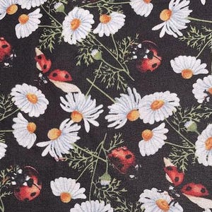 LADYBUGS and Daisies on black background.   Very colorful cotton print!