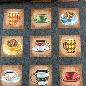 May include: A fabric print featuring a grid of brown squares, each containing a different coffee cup or mug. The cups display various patterns including diamonds, polka dots, and stripes in colors like red, yellow, blue, and green. The background is dark gray with a subtle leaf pattern.
