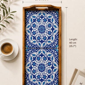 May include: A rectangular wooden serving tray featuring two inset ceramic tiles with a blue and white floral mandala pattern. The tray has cut-out handles on both ends and measures 7.9 inches in width by 15.7 inches in length as indicated.