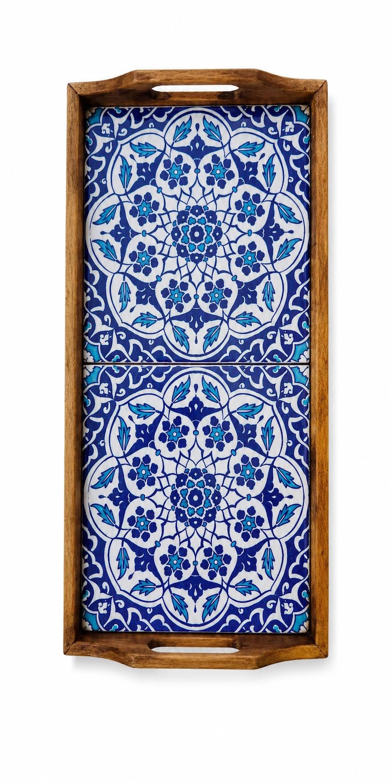 May include: A rectangular wooden serving tray featuring two inset ceramic tiles. The tiles display a symmetrical floral pattern in shades of deep blue, light blue, and white. The tray has integrated handles on the top and bottom edges.