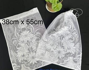 Elegant Drawstring net bags of various sizes to organise your produce, laundry or travel items. Upcycled durable and washable pouches