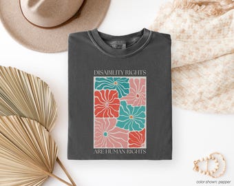 Camiseta "Los derechos de las personas con discapacidad son derechos humanos", camiseta "Diversidad", camiseta "Defensor de la inclusión", camiseta "Conciencia de la igualdad" con estampado floral.