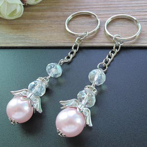12 pcs/pack, beautiful baptism pink angel keychains are excellent favors for your guests. A special gift they&#39;re sure to cherish. JK139sil-P