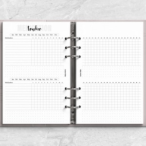 a planner with a pen on top of it
