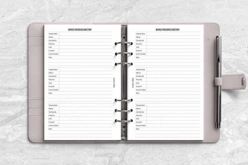 a planner with a pen on top of it