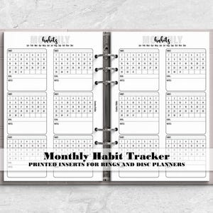 a planner with the words month habit tracker printed on it