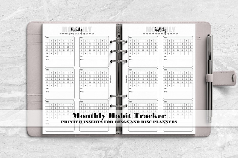a planner with the words month habit tracker printed on it