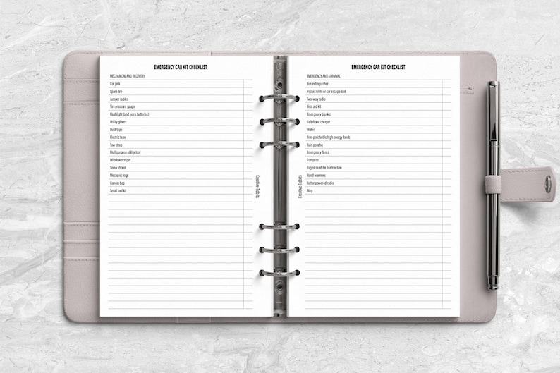 a planner with a pen on top of it