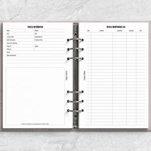 a planner with a pen on top of it