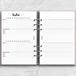 a planner with a pen on top of it