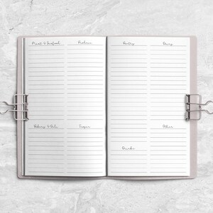 a notebook with a ring binder on top of it