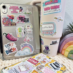 a cup of coffee and some stickers on a table