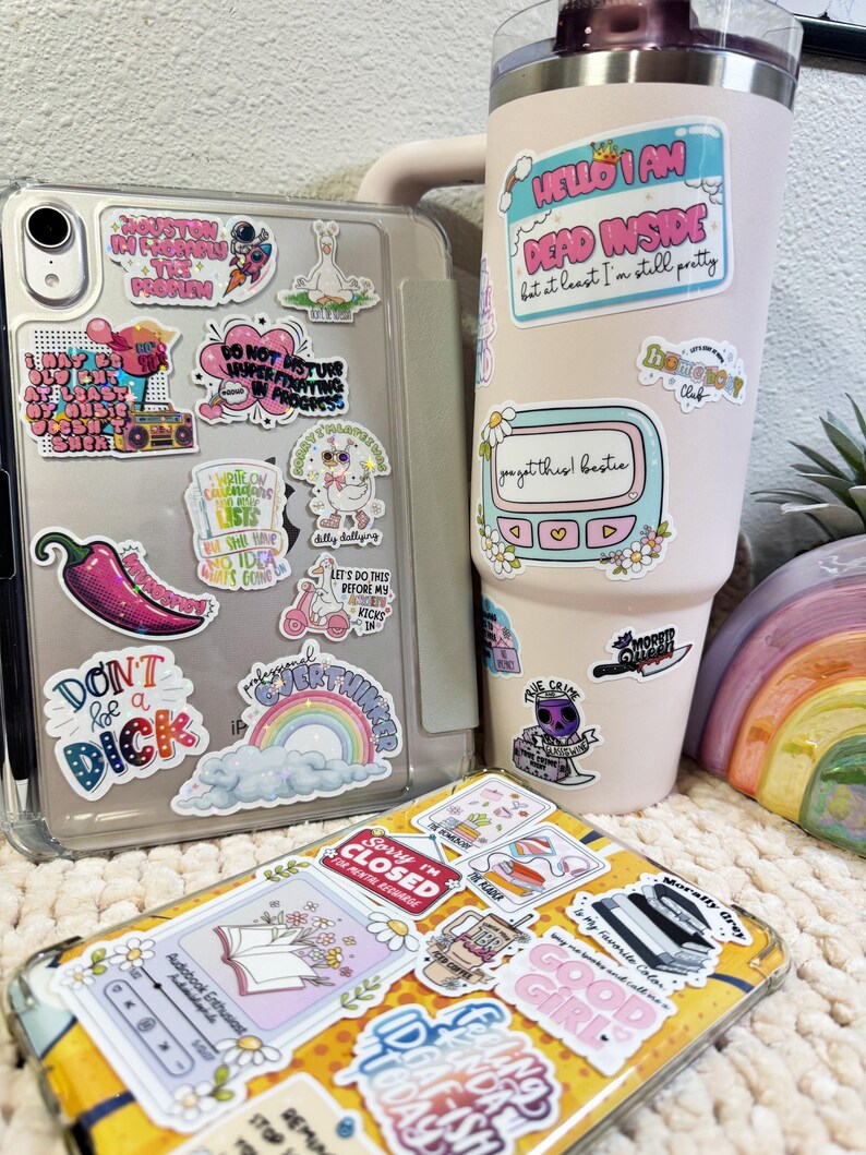 a cup of coffee and some stickers on a table