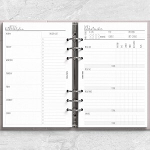 a planner with a pen on top of it