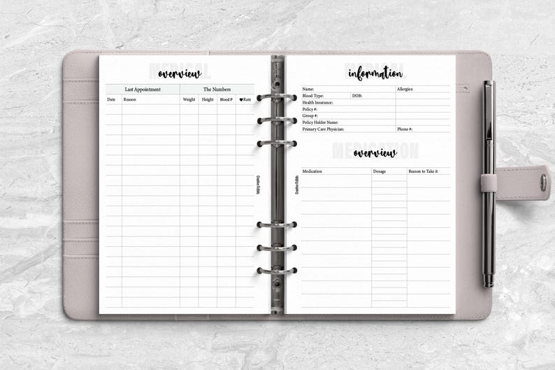 a planner with a pen on top of it