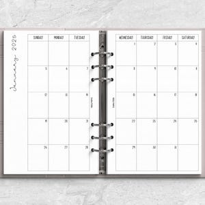 a planner with a pen on top of it