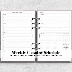 May include: A light gray six-ring planner binder containing white paper inserts for a weekly cleaning schedule. The pages feature lined sections for Monday through Sunday, a daily tasks grid, and the text you can do anything but you don't have to do everything. A silver pen is attached to the side.