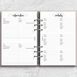 a planner with a pen on top of it