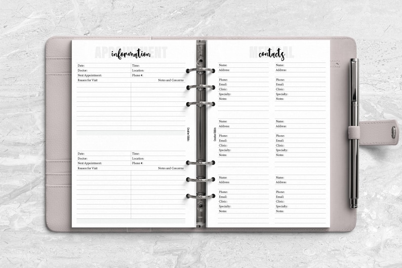 a planner with a pen on top of it