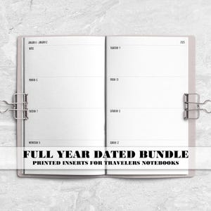 May include: Open notebook with weekly planner pages, held together with silver binder clips. The text "FULL YEAR DATED BUNDLE" and "PRINTED INSERTS FOR TRAVELERS NOTEBOOKS" is displayed at the bottom of the image. The notebook is on a white marble surface.