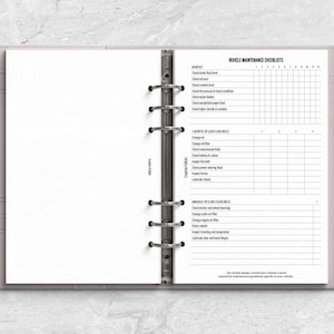 a planner with a pen on top of it