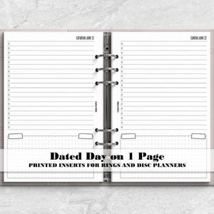 May include: A light gray ring-bound planner open to two pages dated Saturday June 21 and Sunday June 22. Each page features horizontal lines for notes, a vertical checklist, and a bottom section with a dot grid. A silver pen is held in the side loop.