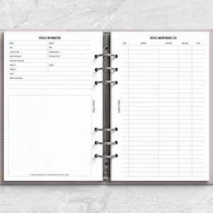 a planner with a pen on top of it