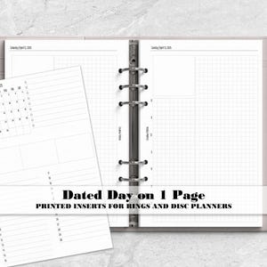 May include: A light gray ring planner containing white paper inserts with grid layouts and a monthly calendar for April 2025. A silver pen is attached to the side. The text reads Dated Day on 1 Page, PRINTED INSERTS FOR RINGS AND DISC PLANNERS.