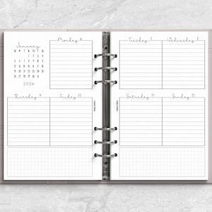 a planner with a pen on top of it