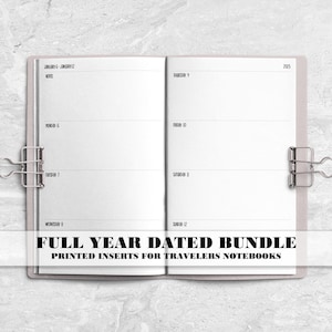 May include: An open planner with white pages featuring a weekly layout, dated for 2025, held open by two silver metal binder clips. The text on the page reads FULL YEAR DATED BUNDLE PRINTED INSERTS FOR TRAVELERS NOTEBOOKS in bold black letters.