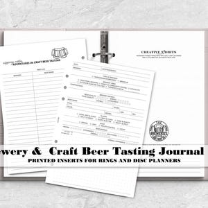 May include: A light gray ring-bound planner containing white paper inserts for tracking craft beer tastings. The pages feature printed fields for brewery names, beer types, flavor profiles, and ratings, with a small beer mug icon at the top.