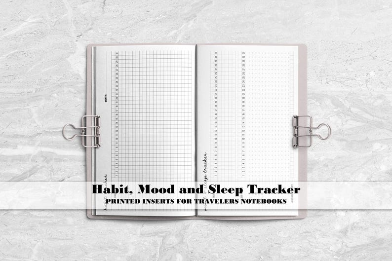 a notebook with the words habit, mood and sleep tracker printed on it
