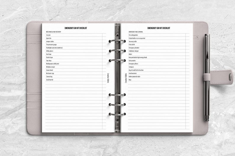 a planner with a pen on top of it