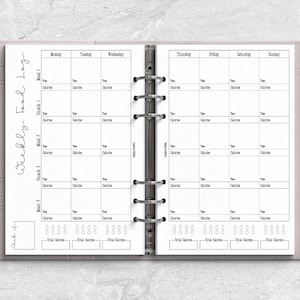 a planner with a pen on top of it
