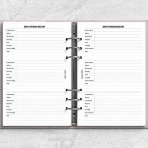 a planner with a pen on top of it