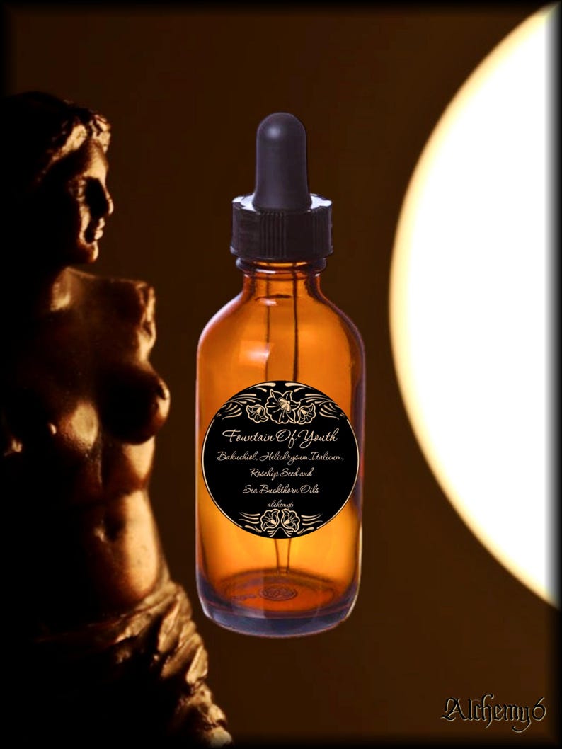 May include: An amber glass dropper bottle with a black cap and a circular black label. The label features the text Fountain Of Youth, Bakuchiol, Helichrysum Italicum, Rosehip Seed and Sea Buckthorn Oils, and Alchemy&oacute;, decorated with floral motifs.