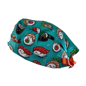 May include: A teal blue surgical scrub hat with a fun pattern of cartoon sushi rolls. The hat has orange ties.