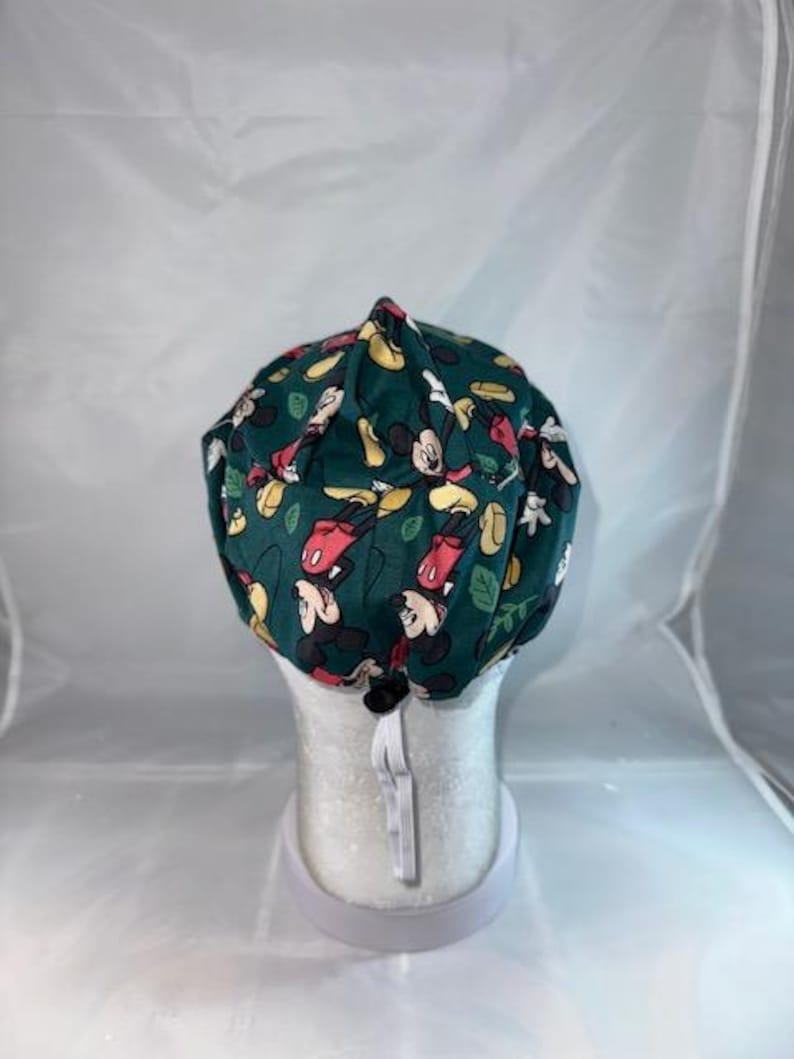 a hat with a mickey mouse pattern on it