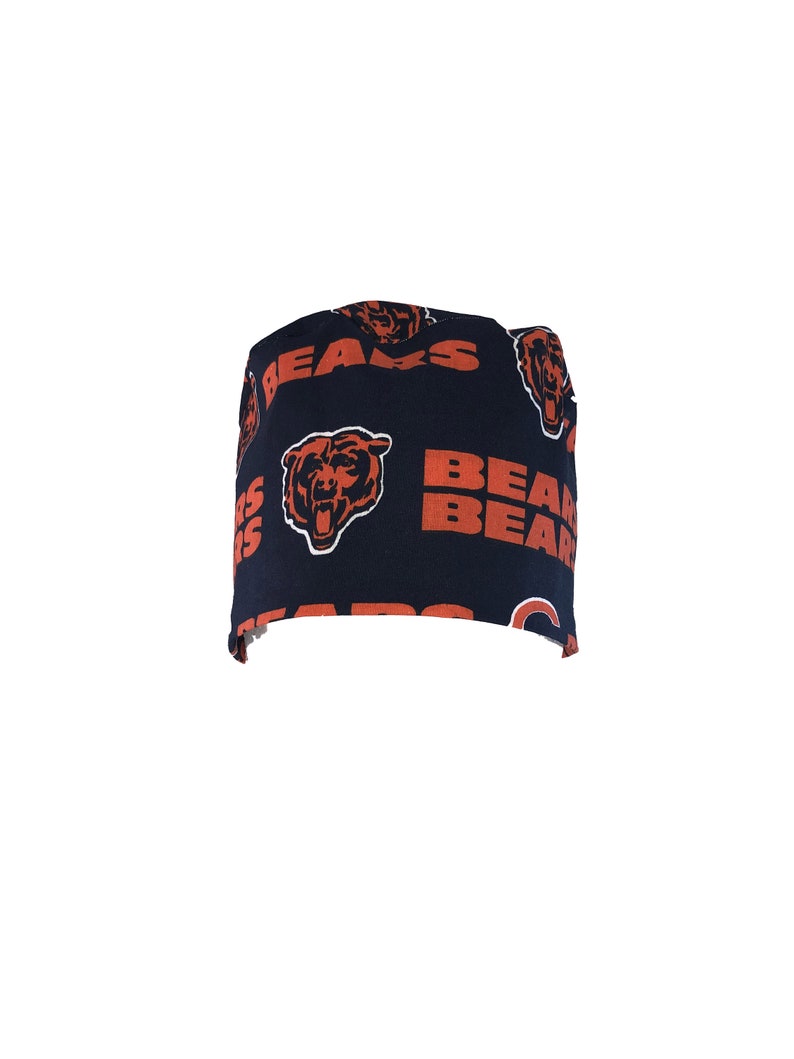 May include: A black scrub hat with a repeating pattern of orange "BEARS" text and bear head logos.