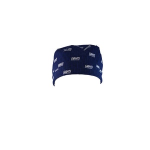 May include: A navy blue scrub hat with a white "Giants" pattern.