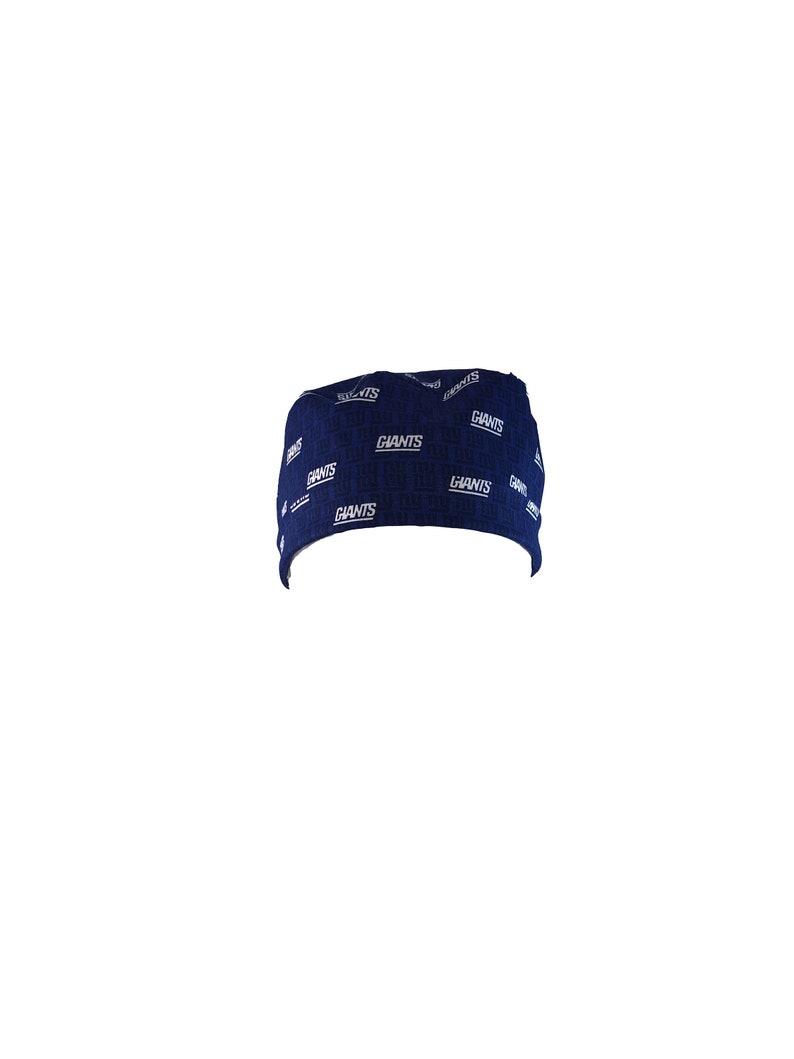 May include: A navy blue scrub hat with a white "Giants" pattern.