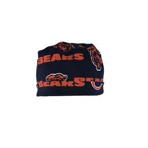 May include: Black beanie with a repeating pattern of orange bears and the word "BEARS" in orange.