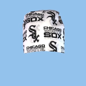 May include: White fabric headband with a black and white print of the Chicago White Sox logo and the words "Chicago White Sox".