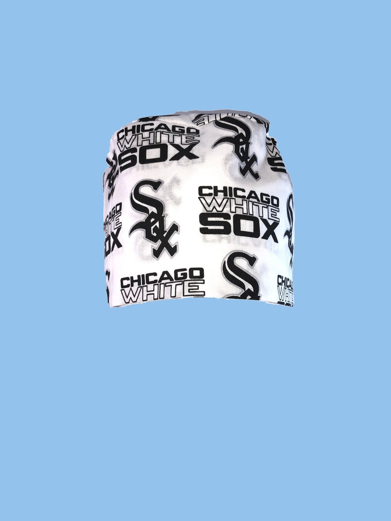 May include: White fabric headband with a black and white print of the Chicago White Sox logo and the words "Chicago White Sox".