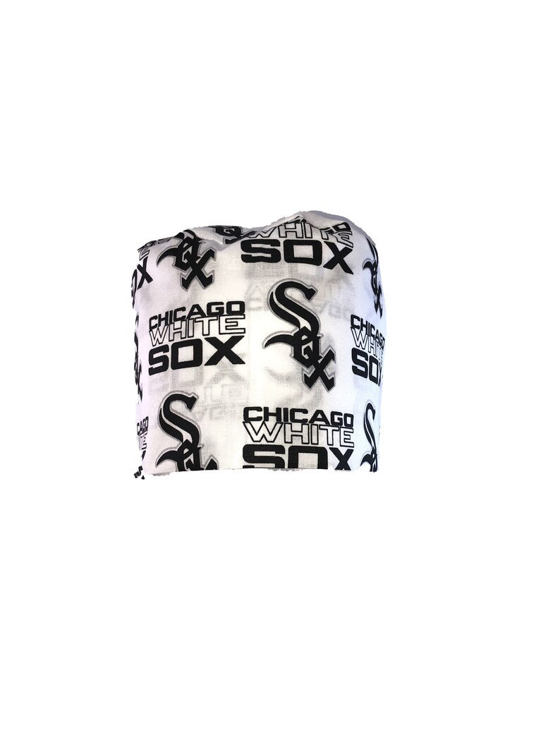 May include: White fabric headband with a black and white repeated pattern of the Chicago White Sox logo and the words "Chicago White Sox".