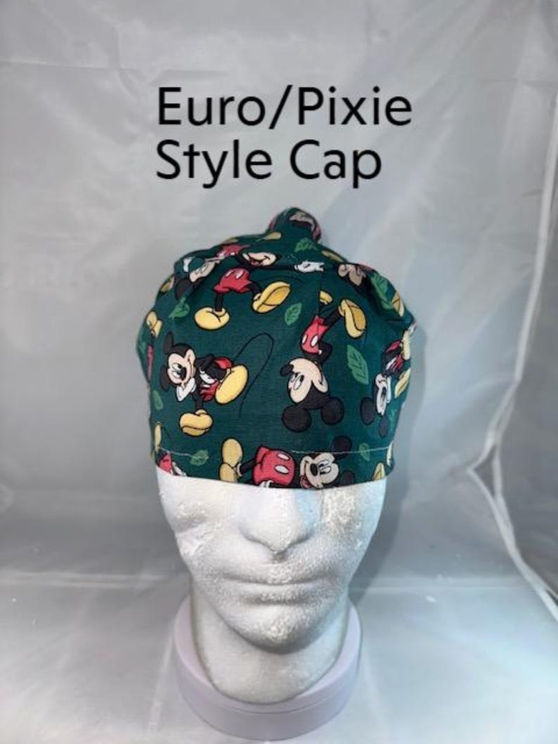 a white mannequin head wearing a green mickey mouse hat