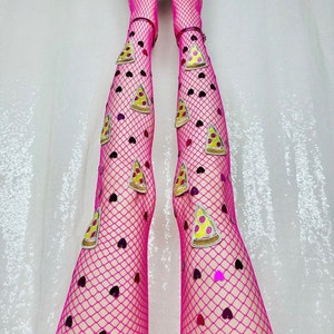 May include: Pink fishnet stockings with heart-shaped sequins and pizza slice appliques. The stockings are paired with pink high heels.